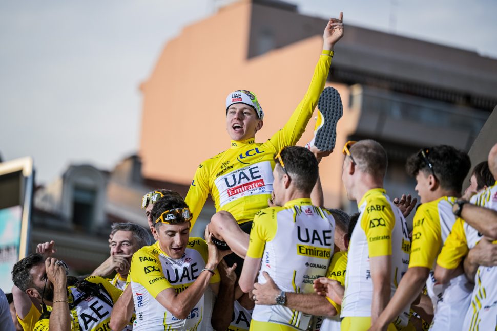 tadej pogacar being held aloft by his teammates after winning 2024 Tour de France